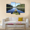 Kayak surfer on a lake Multi panel canvas wall art