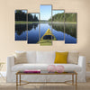 Kayak surfer on a lake Multi panel canvas wall art