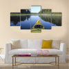 Kayak surfer on a lake Multi panel canvas wall art