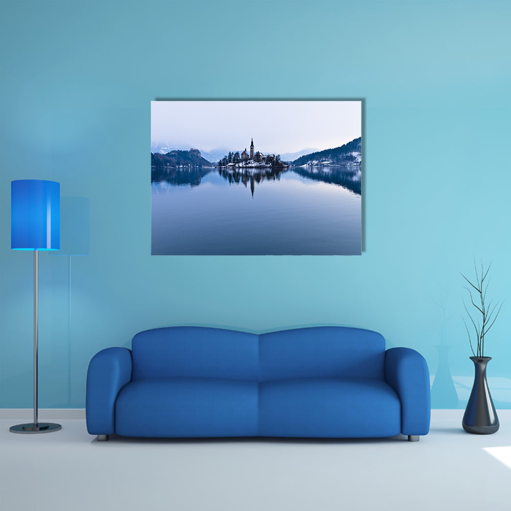 The perfect symmetry of a lake and church on a small island canvas wall art