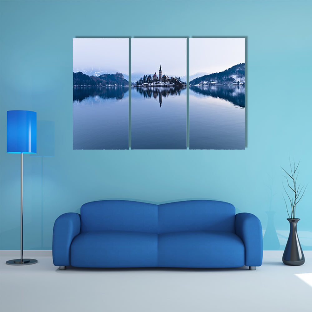 The perfect symmetry of a lake and church on a small island canvas wall art
