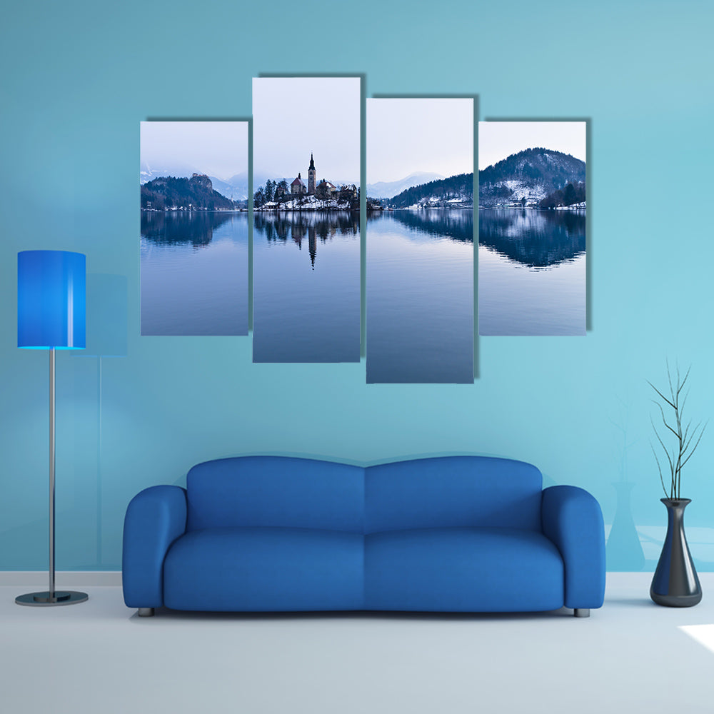 The perfect symmetry of a lake and church on a small island canvas wall art
