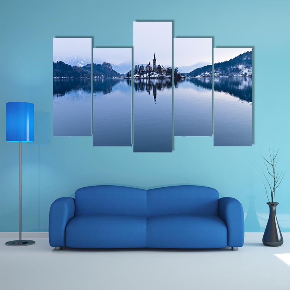 The perfect symmetry of a lake and church on a small island canvas wall art