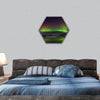 Flash of Aurora polaris above water hexagonal canvas wall art