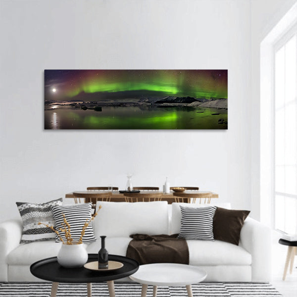 Flash of Aurora polaris above water panoramic canvas wall art