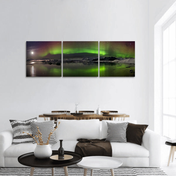 Flash of Aurora polaris above water panoramic canvas wall art