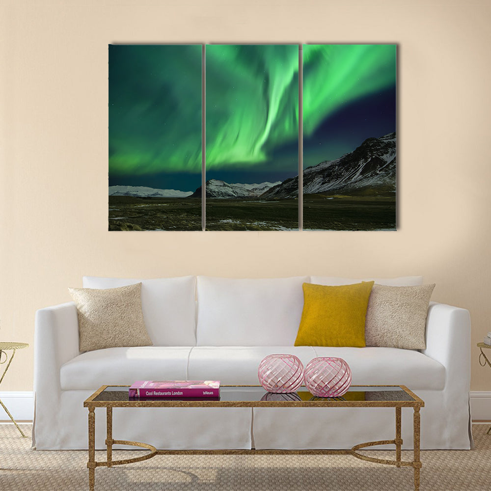 Flash of Aurora polaris above mountains Multi panel canvas wall art