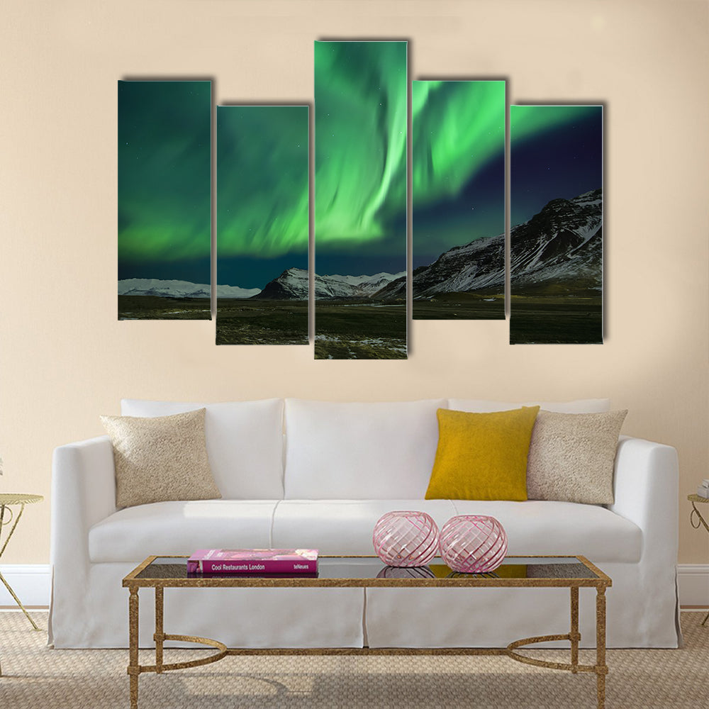 Flash of Aurora polaris above mountains Multi panel canvas wall art