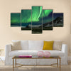 Flash of Aurora polaris above mountains Multi panel canvas wall art