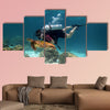 Young Man Scuba Diver between Water Surface near a turtle Multi panel canvas wall art