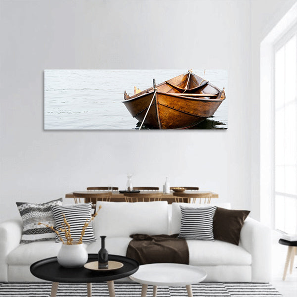 Old wooden row boat on water panoramic canvas wall art