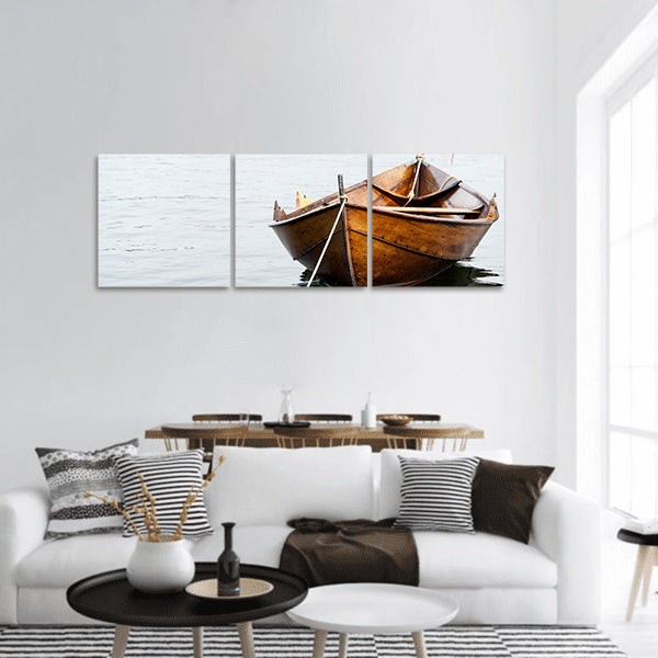 Old wooden row boat on water panoramic canvas wall art