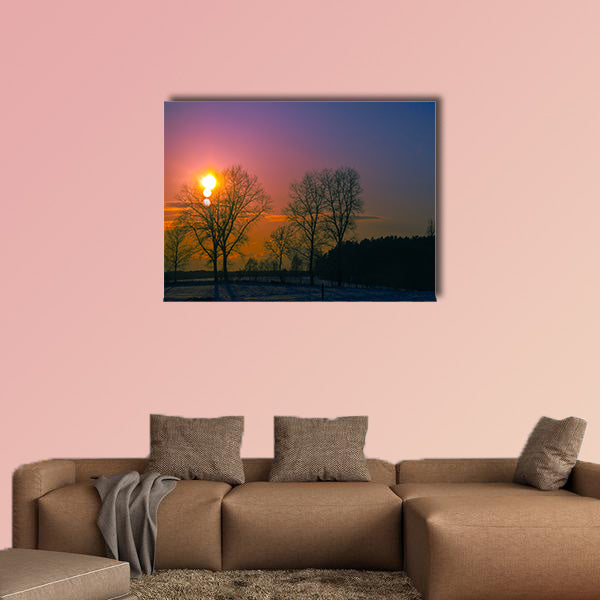 An image of sunset in winter scenery multi panel canvas wall art