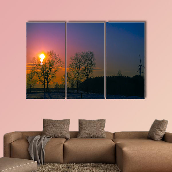 An image of sunset in winter scenery multi panel canvas wall art