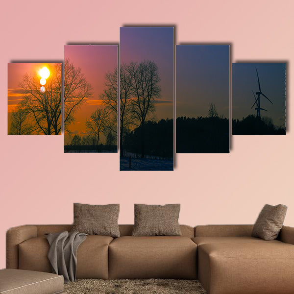 An image of sunset in winter scenery multi panel canvas wall art