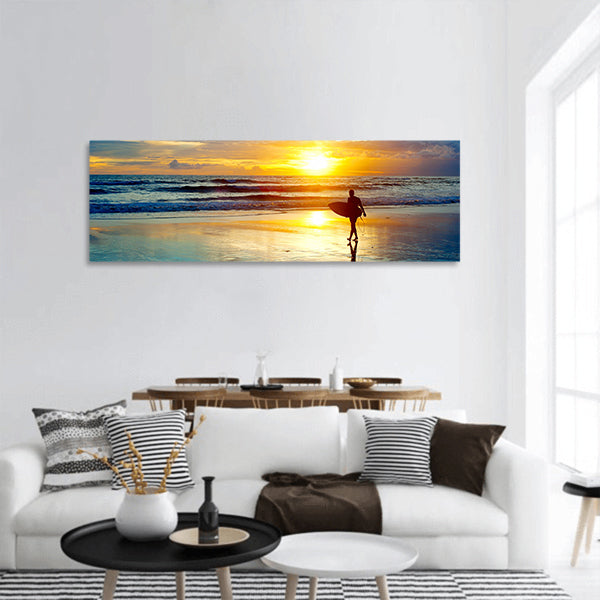 Surfer on the ocean beach at sunset on Bali island, Indonesia panoramic canvas wall art