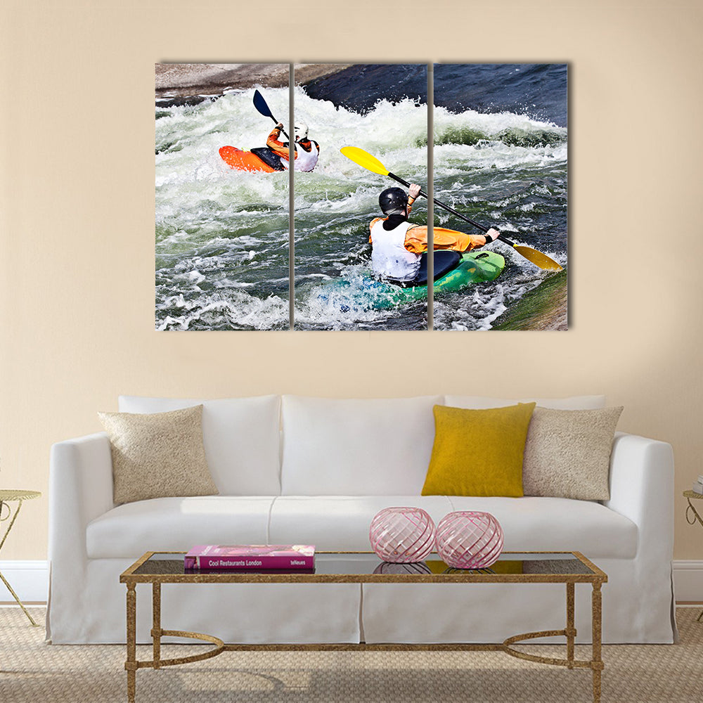 two active kayakers are rolling and surfing in rough water Multi panel canvas wall art