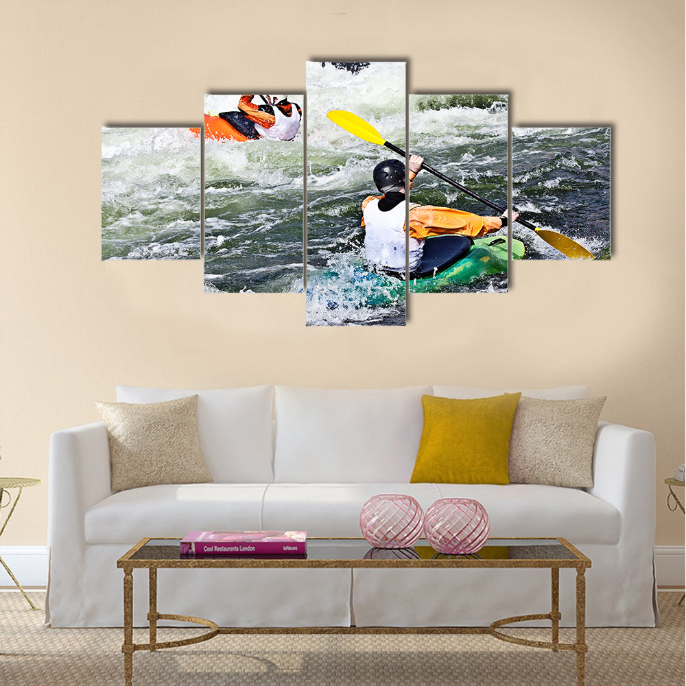 two active kayakers are rolling and surfing in rough water Multi panel canvas wall art
