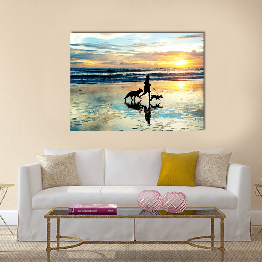 A Man With Dogs Running On Bali Island On Sunset, Indonesia Multi Panel Canvas Wall Art