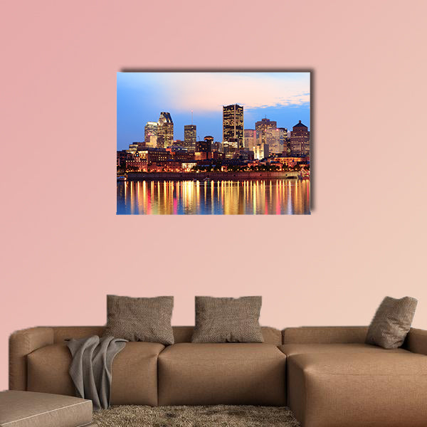 Montreal over river at sunset with city lights and urban buildings wall art