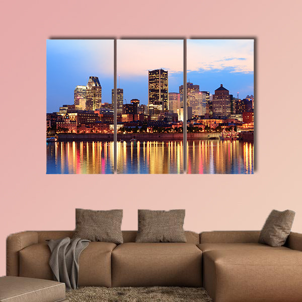 Montreal over river at sunset with city lights and urban buildings wall art