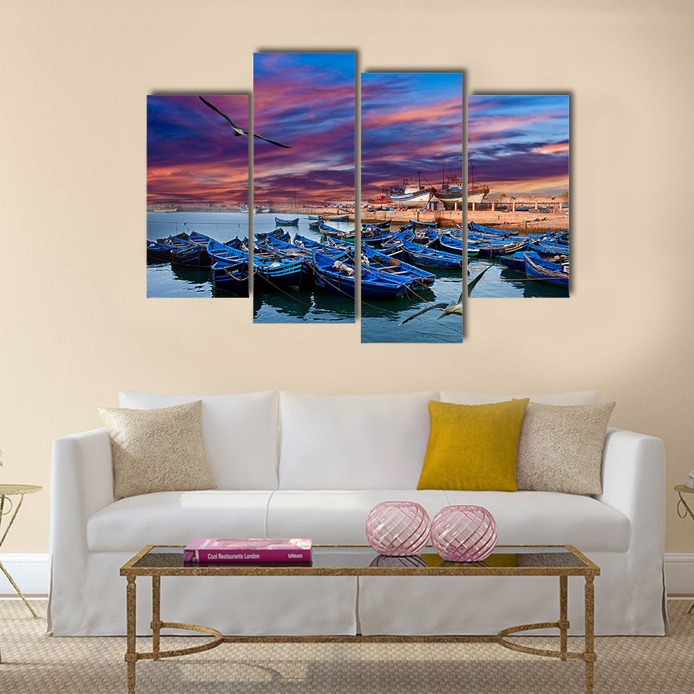 Blue fishing boats on an ocean coast in Essaouira, Morocco Multi panel canvas wall art