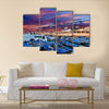 Blue fishing boats on an ocean in Morocco Multi Panel Canvas Wall Art