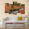 The falling leaves colors the autumn season in the forest Multi Panel Canvas Wall Art