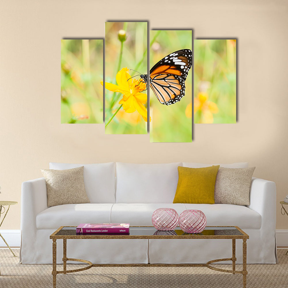 Monarch butterfly on yellow flower Multi Panel Canvas Wall Art