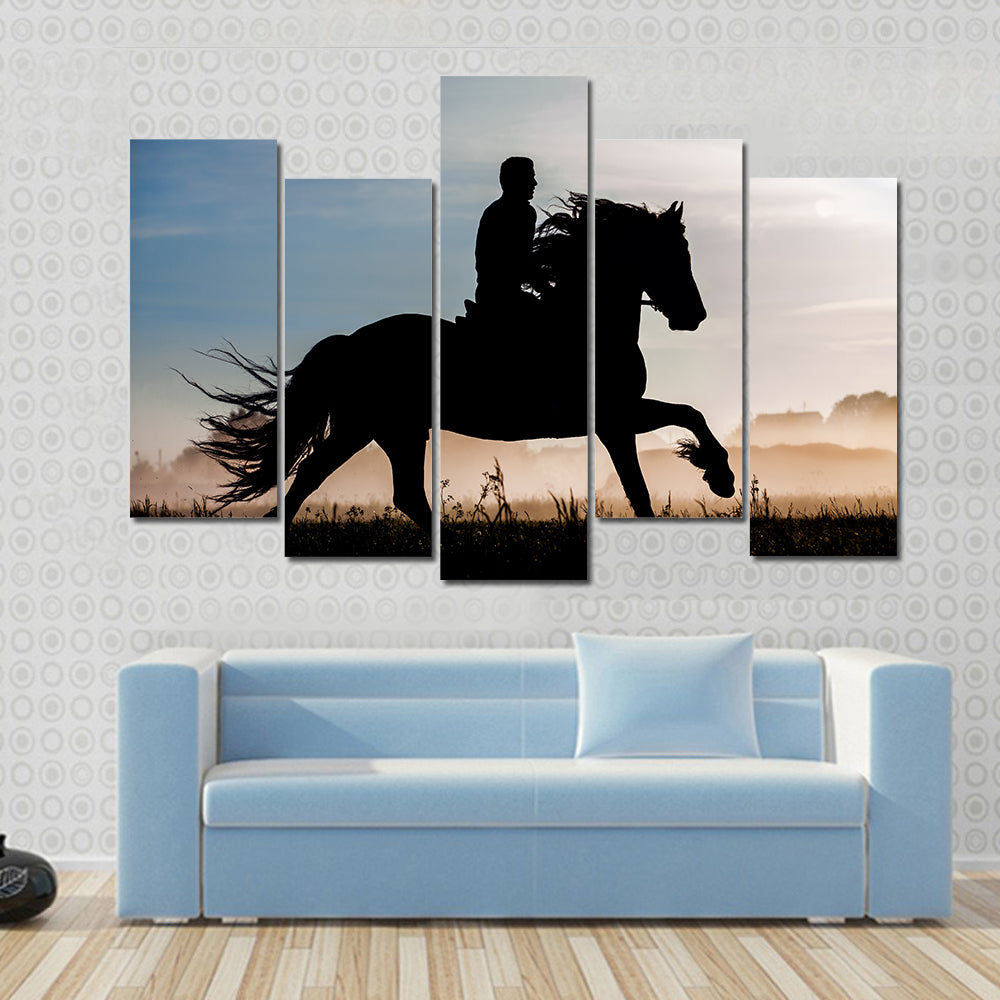 Silhouette of rider and horse in sunset background Multi panel canvas wall art