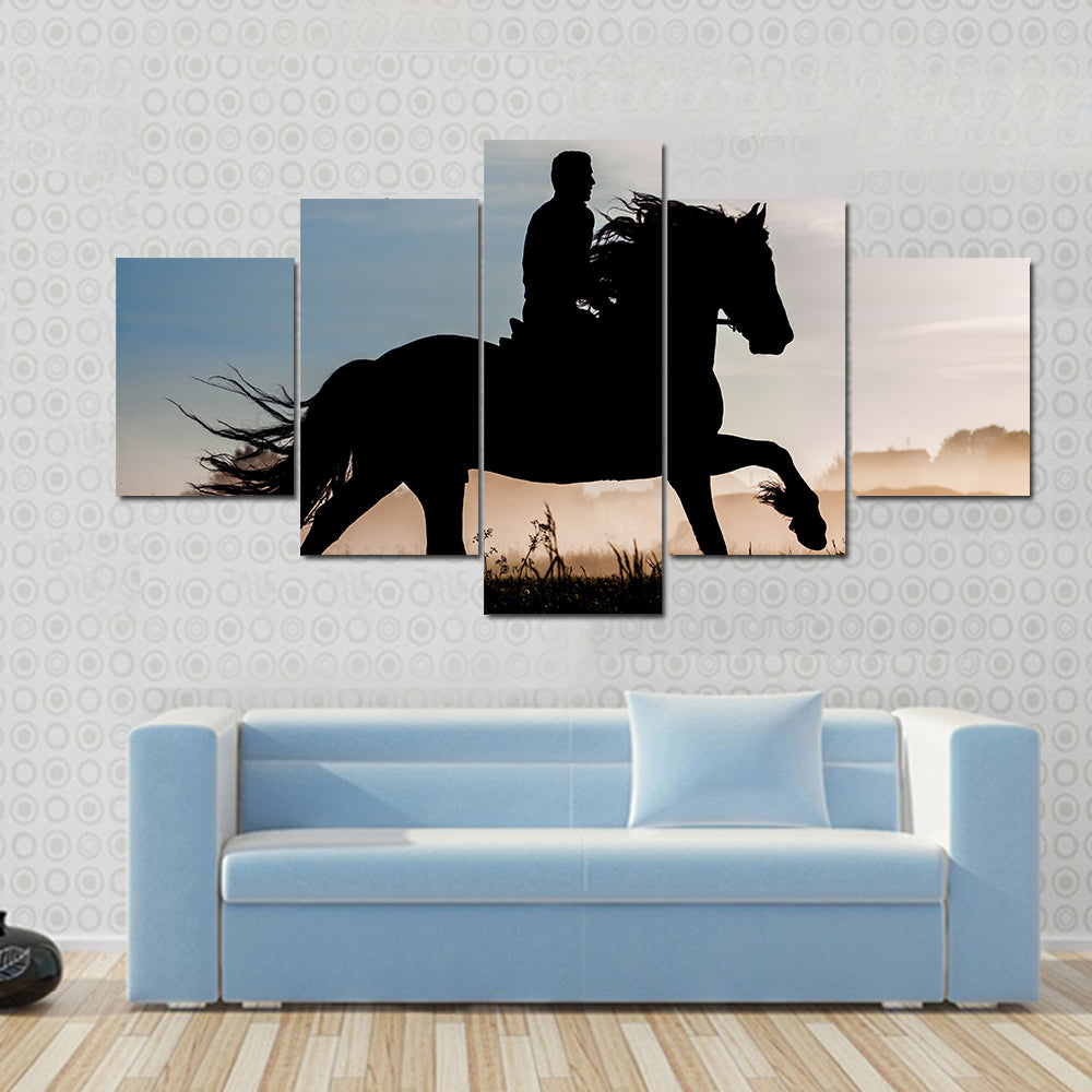 Silhouette of rider and horse in sunset background Multi panel canvas wall art