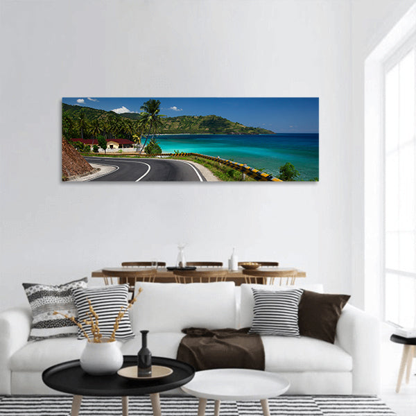 Asphalt road tropical coastline with palm trees and buildings panoramic canvas wall art