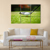 Golf ball on tee in front of driver Multi Panel Canvas Wall Art