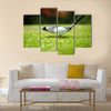 Golf ball on tee in front of driver Multi Panel Canvas Wall Art