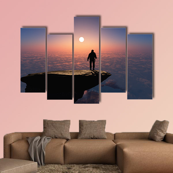 Silhouette of a man on a rock Multi panel canvas wall art
