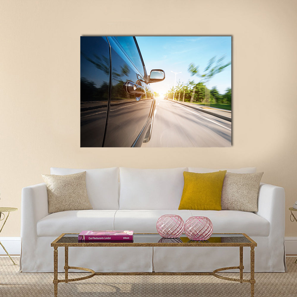 car on the road with motion blur background Multi panel canvas wall art