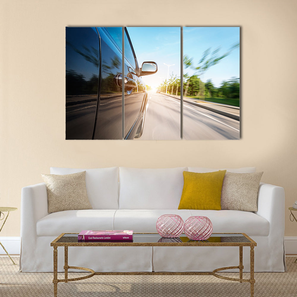 car on the road with motion blur background Multi panel canvas wall art
