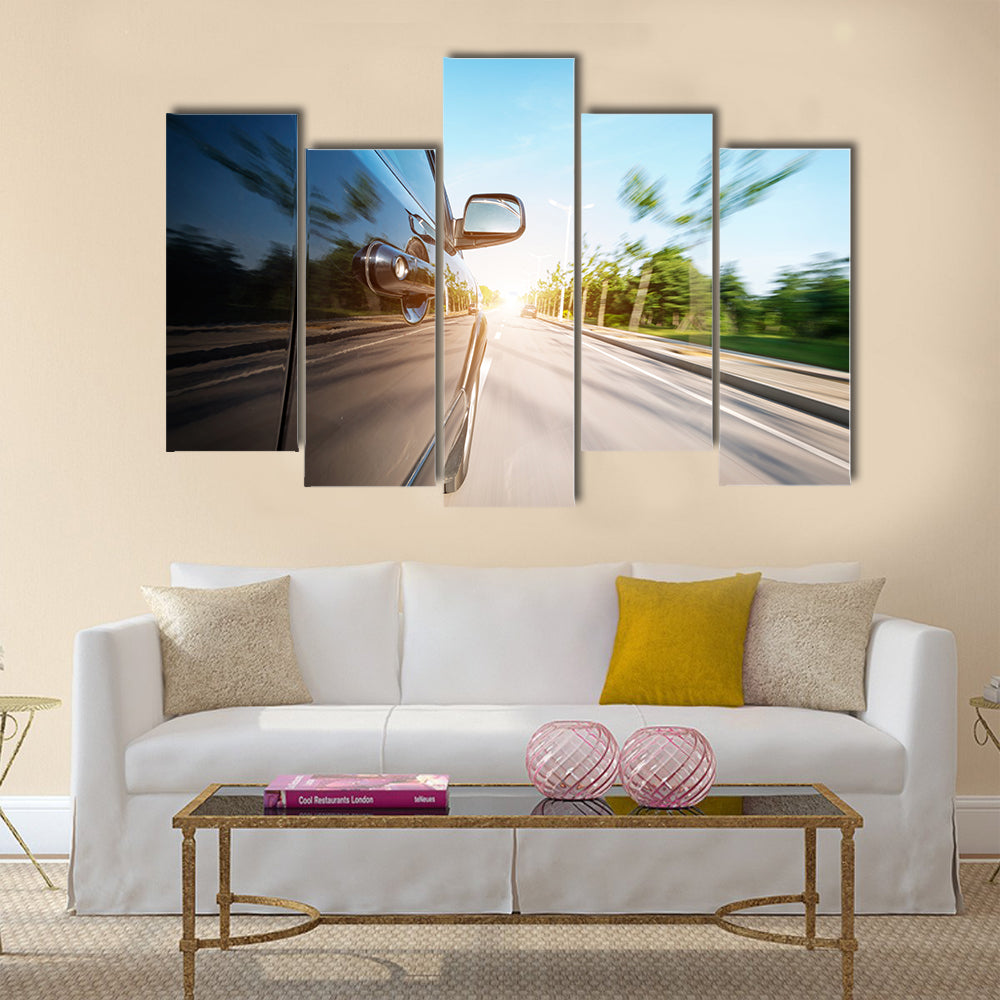 car on the road with motion blur background Multi panel canvas wall art