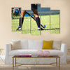 The strong white legs of a sportive young woman playing Hockey sport Multi panel canvas wall art