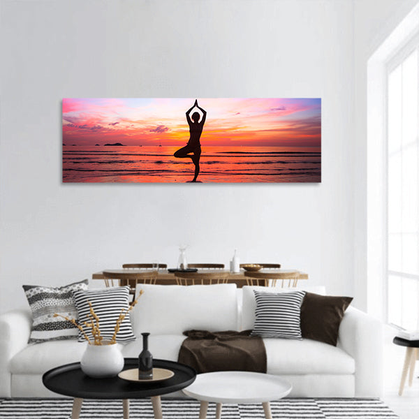 Silhouette woman yoga practice at the seaside at sunset panoramic canvas wall art