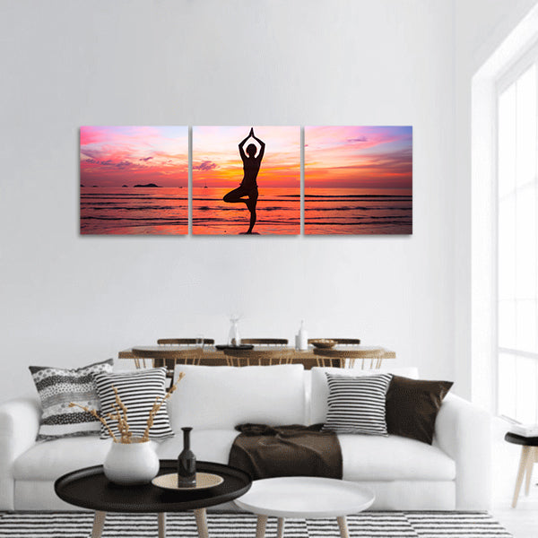 Silhouette woman yoga practice at the seaside at sunset panoramic canvas wall art