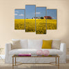 yellow rape field and farmhouses Multi Panel Canvas Wall Art