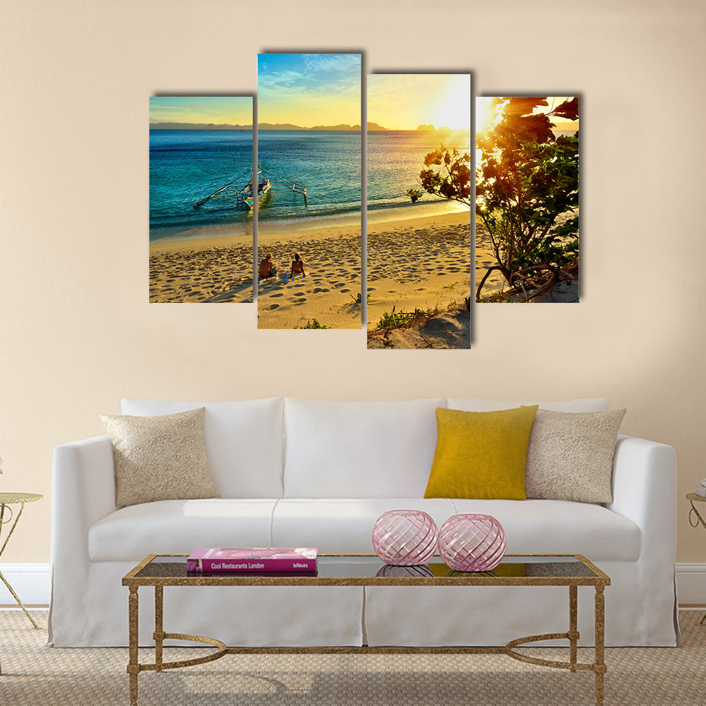 Young happy couple enjoying a beautiful sunset multi panel canvas wall art