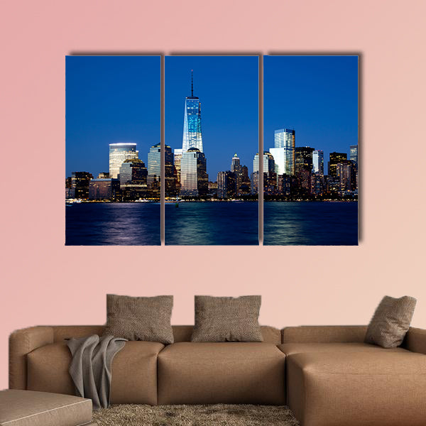 The new Freedom Tower and Lower Manhattan Skyline at Night Multi panel canvas wall art