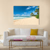 Untouched sandy beach with palms trees and azure ocean in background Multi panel canvas wall art