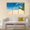 Untouched sandy beach with palms trees and azure ocean in background Multi panel canvas wall art