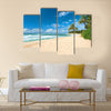 Untouched sandy beach with palms trees and azure ocean in background Multi panel canvas wall art