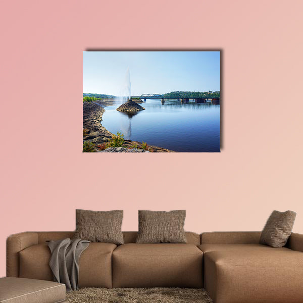 Beautiful water fountain in a river by a bridge, public park wall art