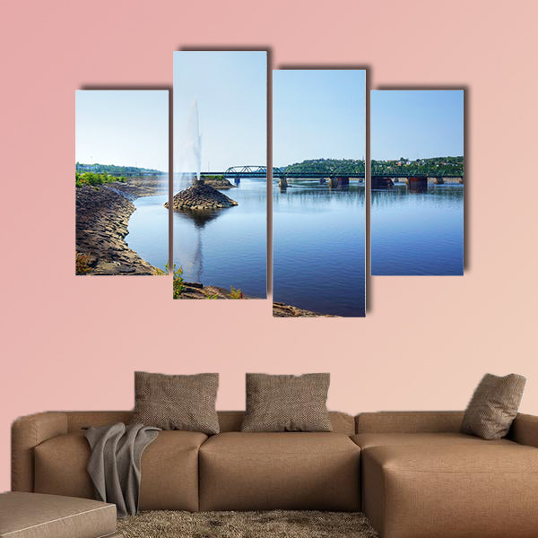 Beautiful water fountain in a river by a bridge, public park wall art