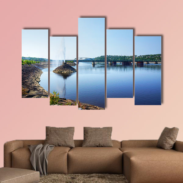 Beautiful water fountain in a river by a bridge, public park wall art